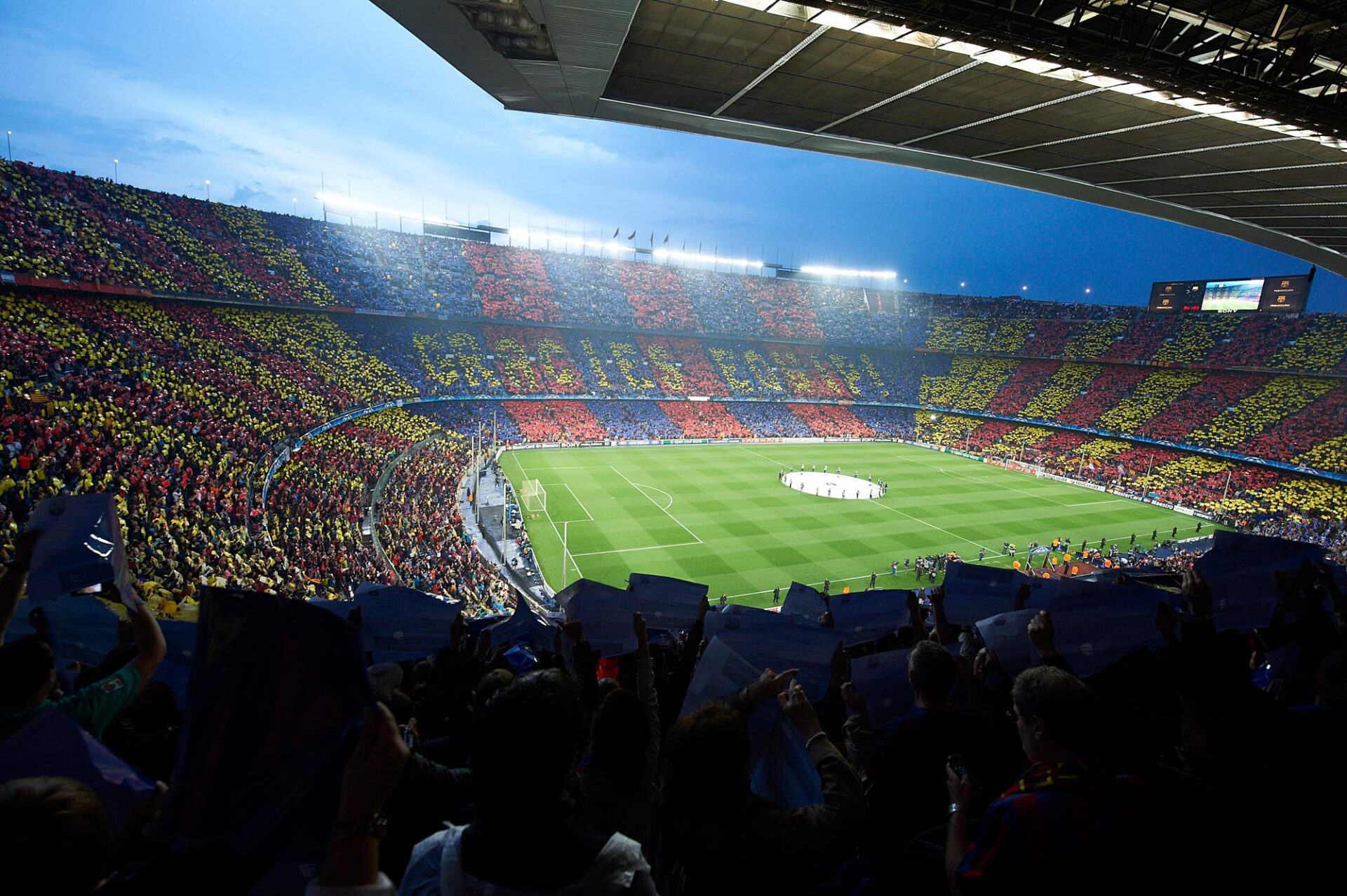 Spotify Camp Nou during a European night match with packed stands and illuminated pitch